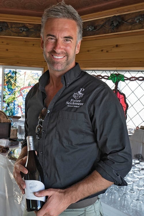 Sandor with wine bottle